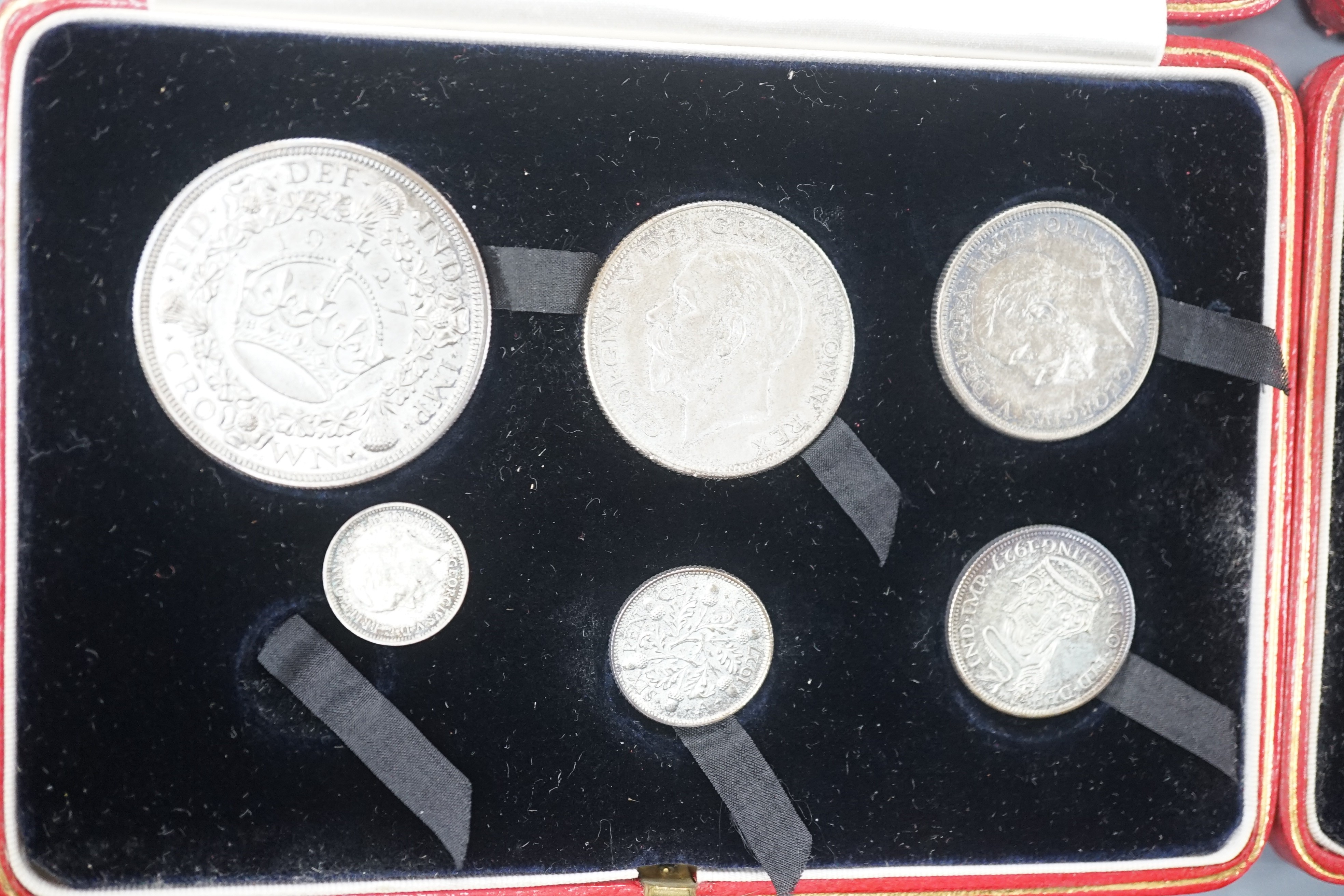 Two George V silver proof coin sets 1927, crown to threepence, (one set missing a threepence), Both sets UNC with toning
